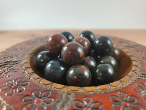 Colorful Ocean Jasper spheres in a decorative bowl